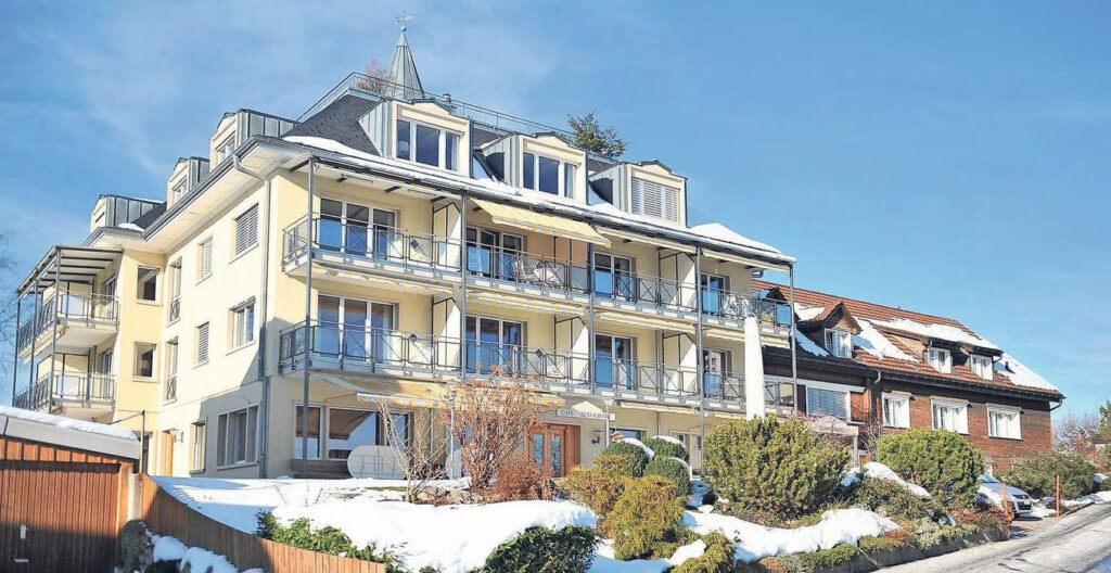 Sonnenberg Health Hotel in Switzerland with balconies and snow-covered surroundings